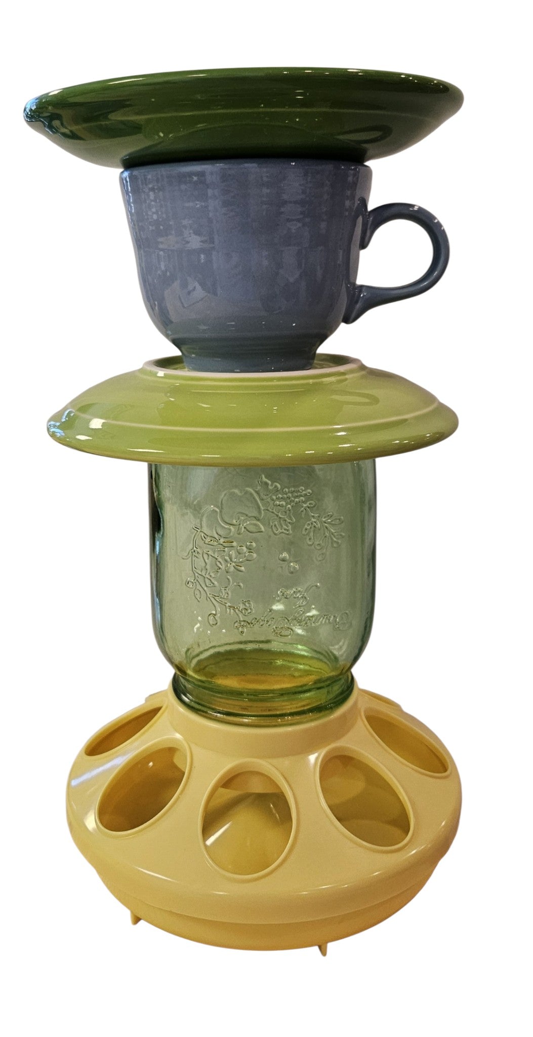 This is a handcrafted Birdfeeder made from a Fiesta Fiestware Cup and two saucers. It includes a glass jar to hold birdseed and either a plastic or metal base for the birds to land and feast. The top saucer is also perfect to hold grape jam or orange slices to feed your local orioles. Please see item description for specific cup and saucer color, jar color and base type. Crafted, Fiesta Second Life
