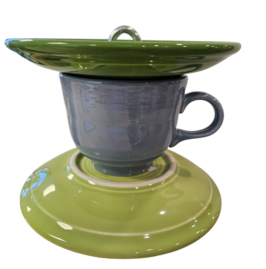 This is a handcrafted Birdfeeder made from a Fiesta Fiestware Cup and two saucers. It includes a glass jar to hold birdseed and either a plastic or metal base for the birds to land and feast. The top saucer is also perfect to hold grape jam or orange slices to feed your local orioles. Please see item description for specific cup and saucer color, jar color and base type. Crafted, Fiesta Second Life
