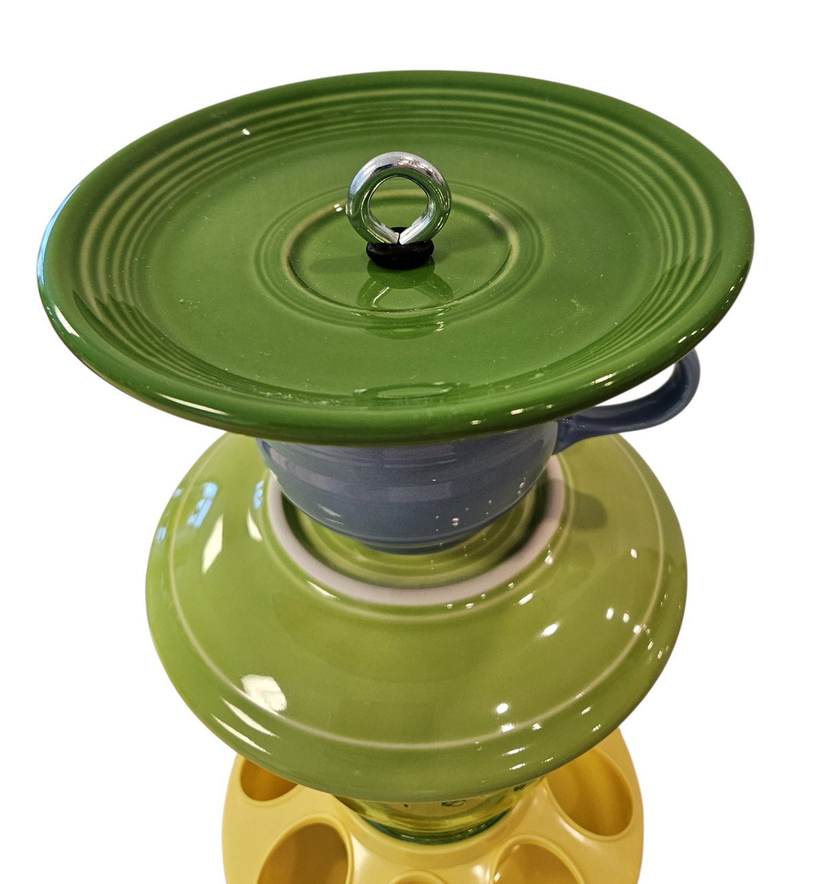 This is a handcrafted Birdfeeder made from a Fiesta Fiestware Cup and two saucers. It includes a glass jar to hold birdseed and either a plastic or metal base for the birds to land and feast. The top saucer is also perfect to hold grape jam or orange slices to feed your local orioles. Please see item description for specific cup and saucer color, jar color and base type. Crafted, Fiesta Second Life
