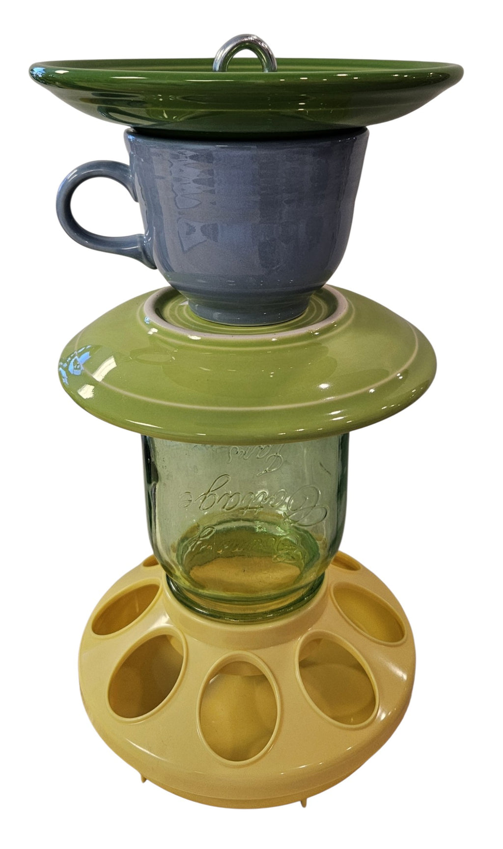 This is a handcrafted Birdfeeder made from a Fiesta Fiestware Cup and two saucers. It includes a glass jar to hold birdseed and either a plastic or metal base for the birds to land and feast. The top saucer is also perfect to hold grape jam or orange slices to feed your local orioles. Please see item description for specific cup and saucer color, jar color and base type. Crafted, Fiesta Second Life
