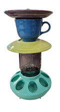 This is a handcrafted Birdfeeder made from a Fiesta Fiestware Cup and two saucers. It includes a glass jar to hold birdseed and either a plastic or metal base for the birds to land and feast. The top saucer is also perfect to hold grape jam or orange slices to feed your local orioles. Please see item description for specific cup and saucer color, jar color and base type. Crafted, Fiesta Second Life
