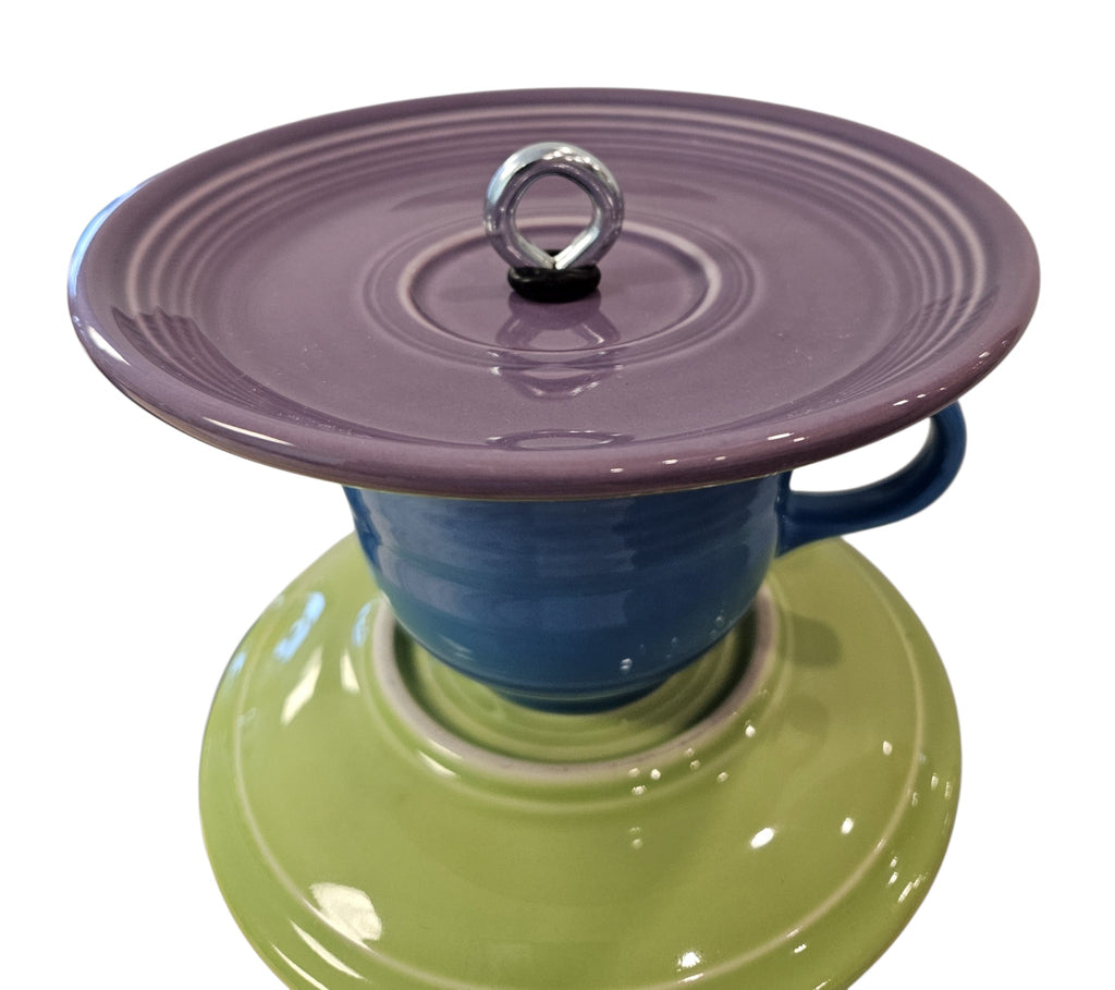 This is a handcrafted Birdfeeder made from a Fiesta Fiestware Cup and two saucers. It includes a glass jar to hold birdseed and either a plastic or metal base for the birds to land and feast. The top saucer is also perfect to hold grape jam or orange slices to feed your local orioles. Please see item description for specific cup and saucer color, jar color and base type. Crafted, Fiesta Second Life
