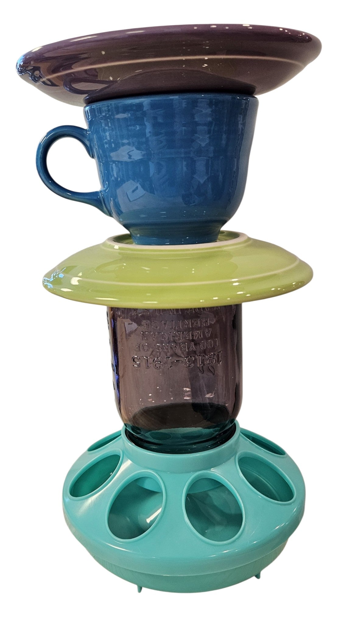 This is a handcrafted Birdfeeder made from a Fiesta Fiestware Cup and two saucers. It includes a glass jar to hold birdseed and either a plastic or metal base for the birds to land and feast. The top saucer is also perfect to hold grape jam or orange slices to feed your local orioles. Please see item description for specific cup and saucer color, jar color and base type. Crafted, Fiesta Second Life
