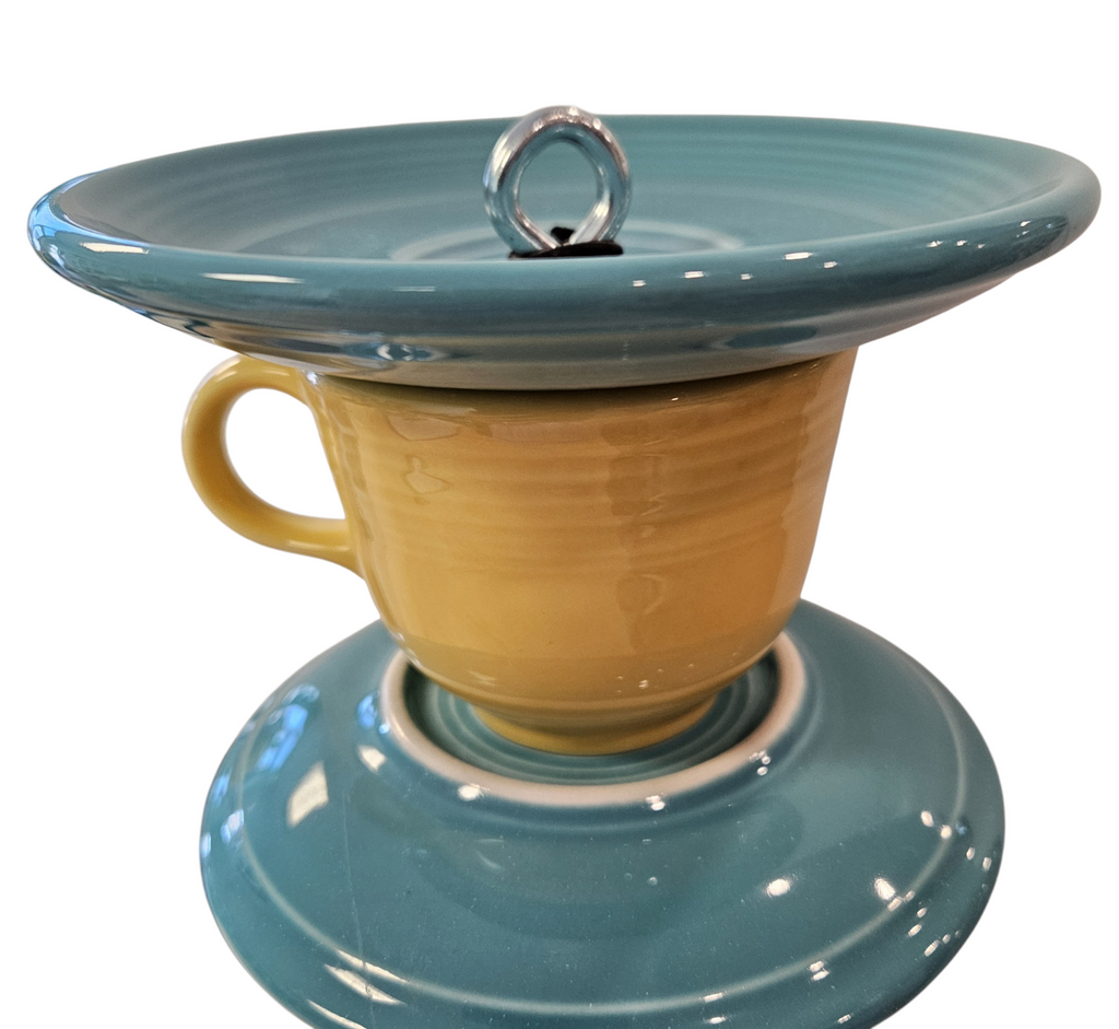 This is a handcrafted Birdfeeder made from a Fiesta Fiestware Cup and two saucers. It includes a glass jar to hold birdseed and either a plastic or metal base for the birds to land and feast. The top saucer is also perfect to hold grape jam or orange slices to feed your local orioles. Please see item description for specific cup and saucer color, jar color and base type. Crafted, Fiesta Second Life
