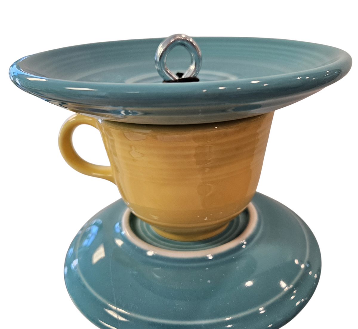 This is a handcrafted Birdfeeder made from a Fiesta Fiestware Cup and two saucers. It includes a glass jar to hold birdseed and either a plastic or metal base for the birds to land and feast. The top saucer is also perfect to hold grape jam or orange slices to feed your local orioles. Please see item description for specific cup and saucer color, jar color and base type. Crafted, Fiesta Second Life
