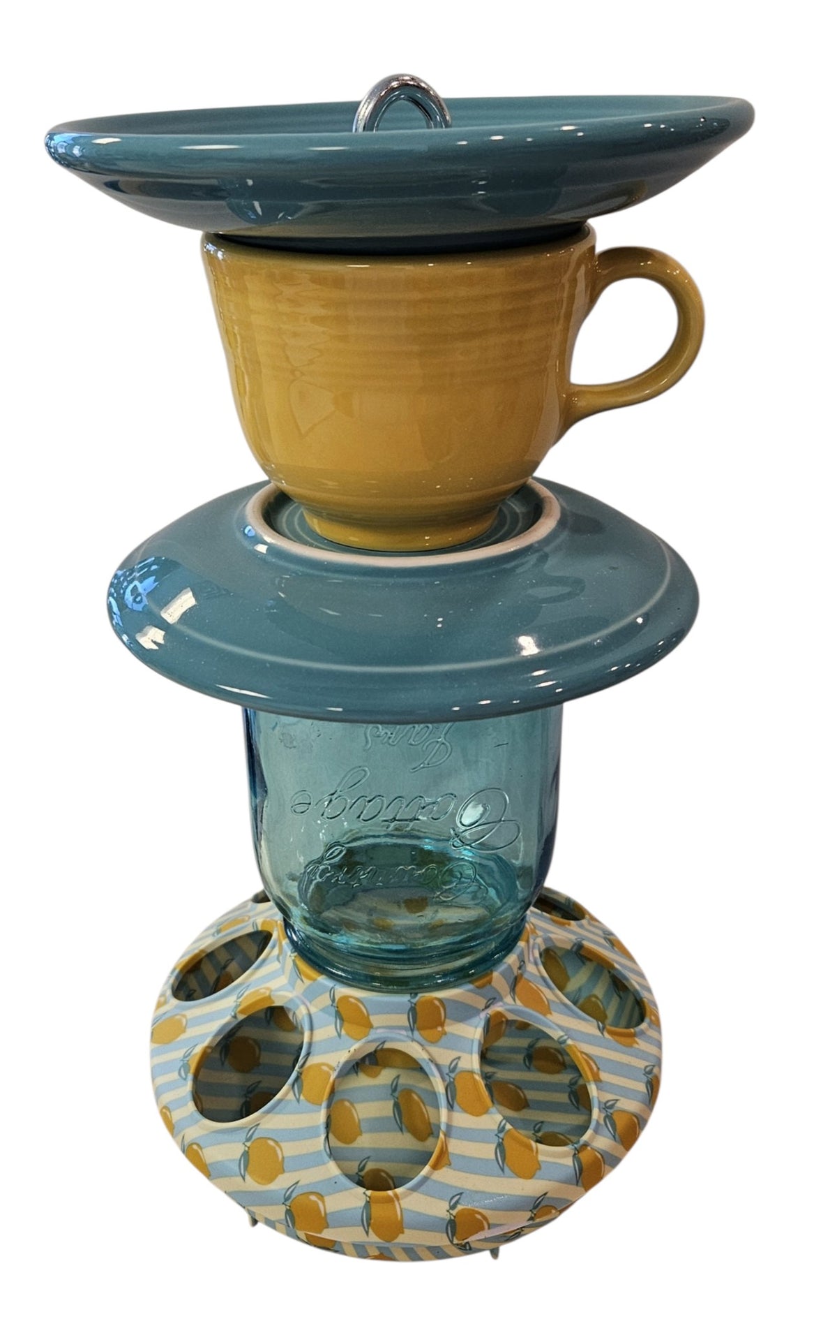 This is a handcrafted Birdfeeder made from a Fiesta Fiestware Cup and two saucers. It includes a glass jar to hold birdseed and either a plastic or metal base for the birds to land and feast. The top saucer is also perfect to hold grape jam or orange slices to feed your local orioles. Please see item description for specific cup and saucer color, jar color and base type. Crafted, Fiesta Second Life
