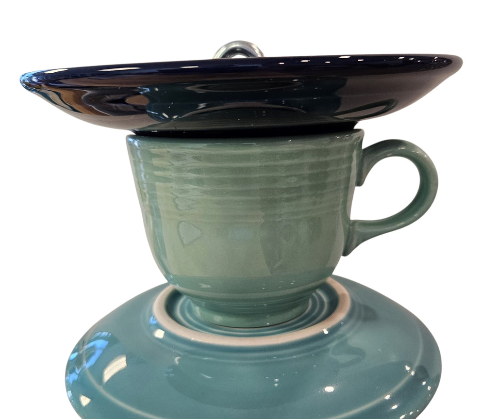 This is a handcrafted Birdfeeder made from a Fiesta Fiestware Cup and two saucers. It includes a glass jar to hold birdseed and either a plastic or metal base for the birds to land and feast. The top saucer is also perfect to hold grape jam or orange slices to feed your local orioles. Please see item description for specific cup and saucer color, jar color and base type. Crafted, Fiesta Second Life
