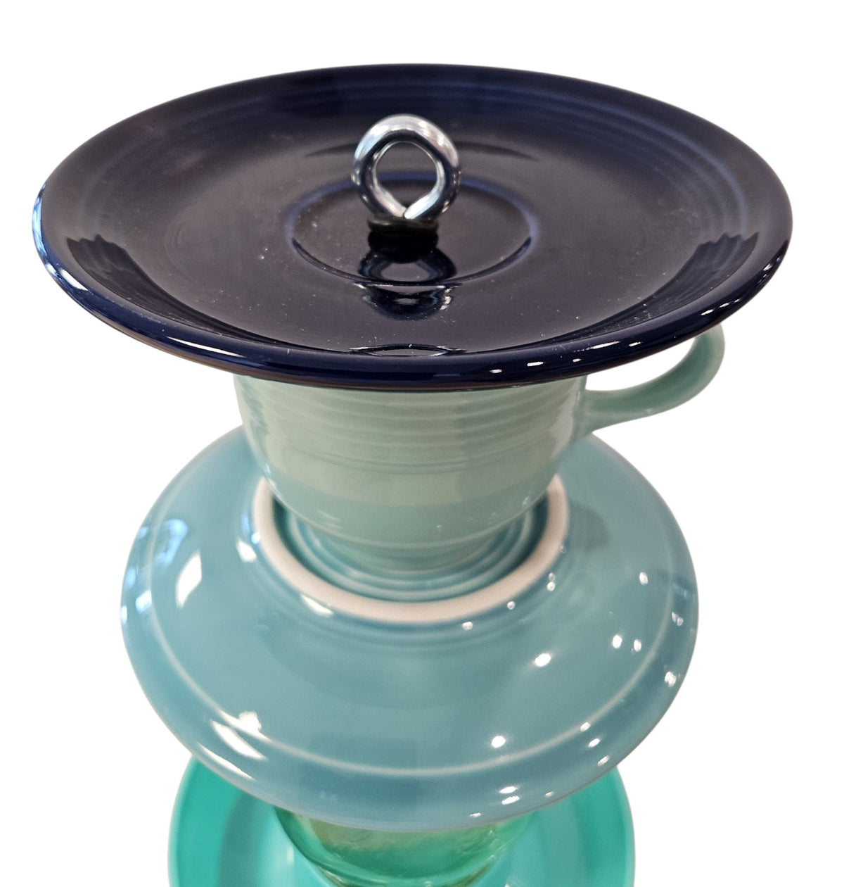 This is a handcrafted Birdfeeder made from a Fiesta Fiestware Cup and two saucers. It includes a glass jar to hold birdseed and either a plastic or metal base for the birds to land and feast. The top saucer is also perfect to hold grape jam or orange slices to feed your local orioles. Please see item description for specific cup and saucer color, jar color and base type. Crafted, Fiesta Second Life
