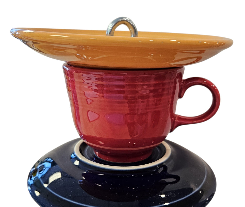 This is a handcrafted Birdfeeder made from a Fiesta Fiestware Cup and two saucers. It includes a glass jar to hold birdseed and either a plastic or metal base for the birds to land and feast. The top saucer is also perfect to hold grape jam or orange slices to feed your local orioles. Please see item description for specific cup and saucer color, jar color and base type. Crafted, Fiesta Second Life
