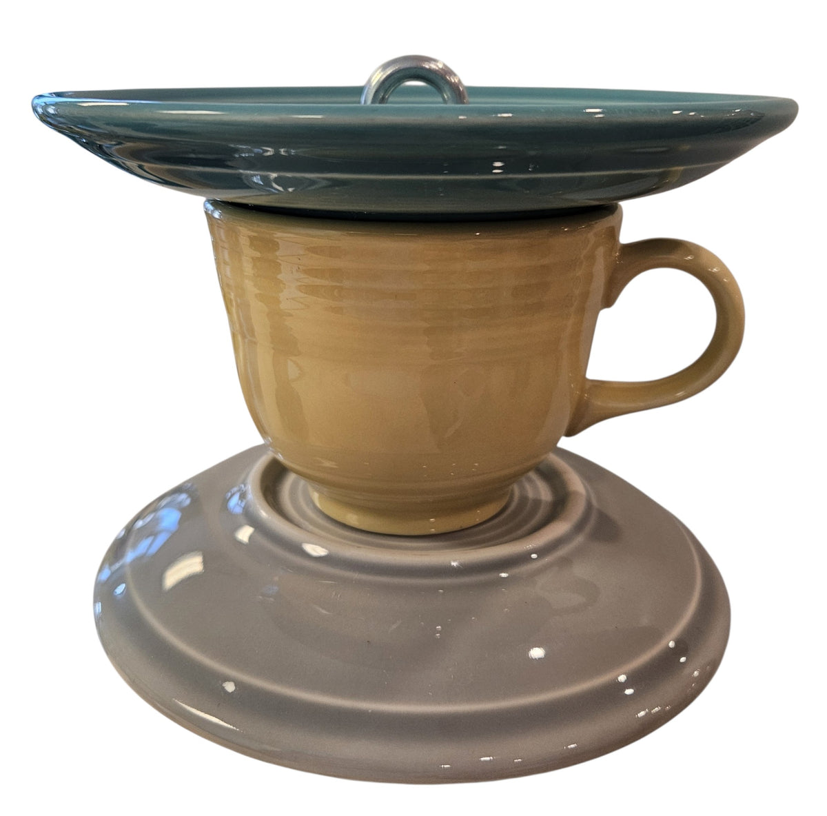 This is a handcrafted Birdfeeder made from a Fiesta Fiestware Cup and two saucers. It includes a glass jar to hold birdseed and either a plastic or metal base for the birds to land and feast. The top saucer is also perfect to hold grape jam or orange slices to feed your local orioles. Please see item description for specific cup and saucer color, jar color and base type. Crafted, Fiesta Second Life
