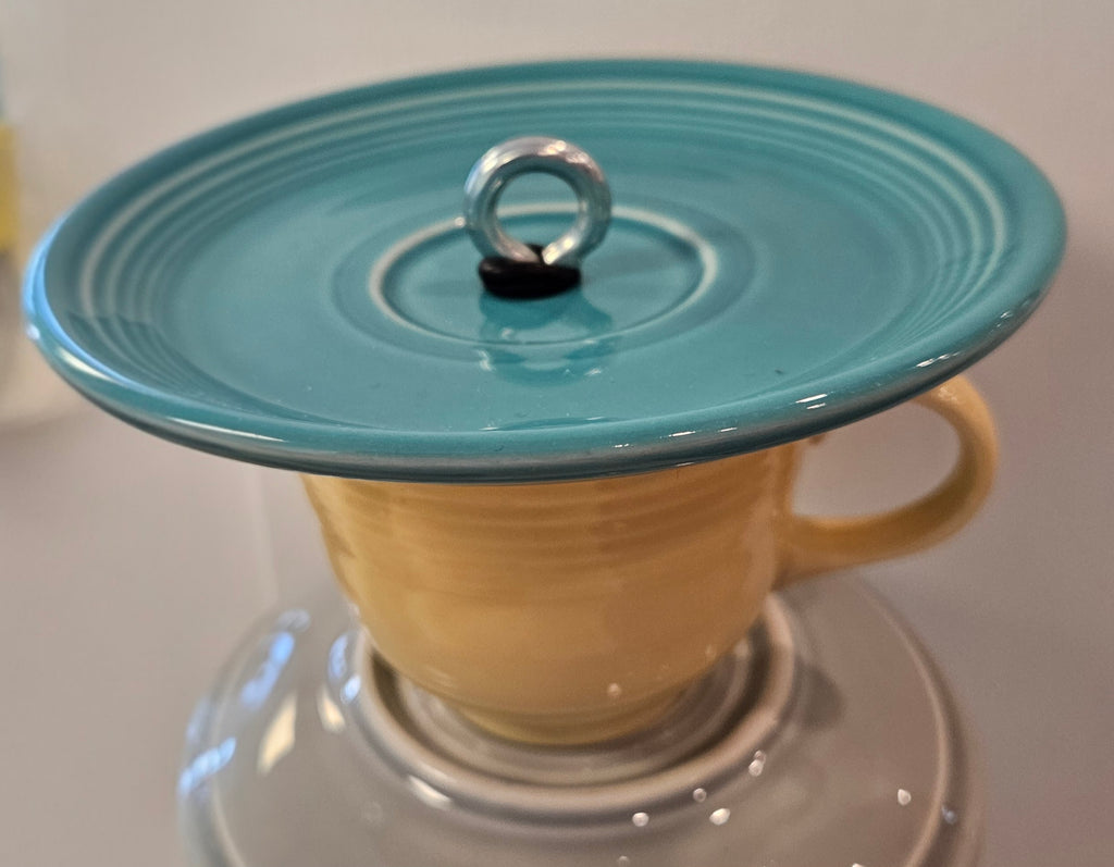 This is a handcrafted Birdfeeder made from a Fiesta Fiestware Cup and two saucers. It includes a glass jar to hold birdseed and either a plastic or metal base for the birds to land and feast. The top saucer is also perfect to hold grape jam or orange slices to feed your local orioles. Please see item description for specific cup and saucer color, jar color and base type. Crafted, Fiesta Second Life
