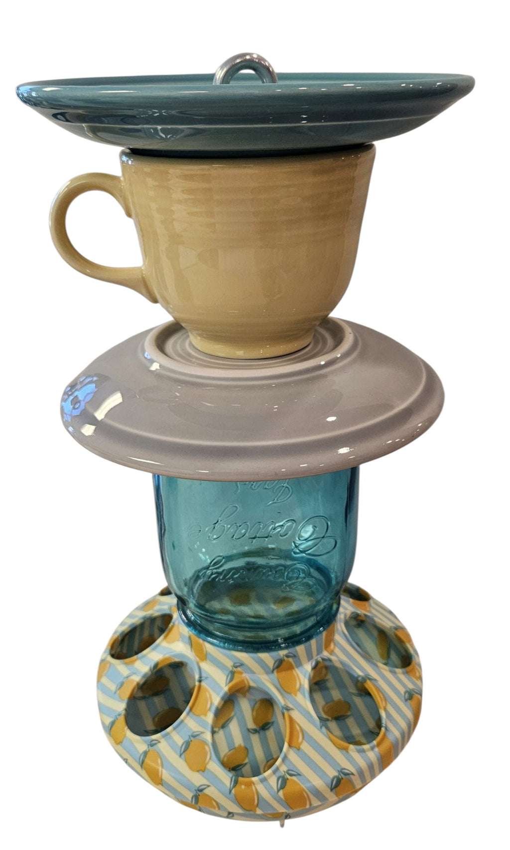 This is a handcrafted Birdfeeder made from a Fiesta Fiestware Cup and two saucers. It includes a glass jar to hold birdseed and either a plastic or metal base for the birds to land and feast. The top saucer is also perfect to hold grape jam or orange slices to feed your local orioles. Please see item description for specific cup and saucer color, jar color and base type. Crafted, Fiesta Second Life
