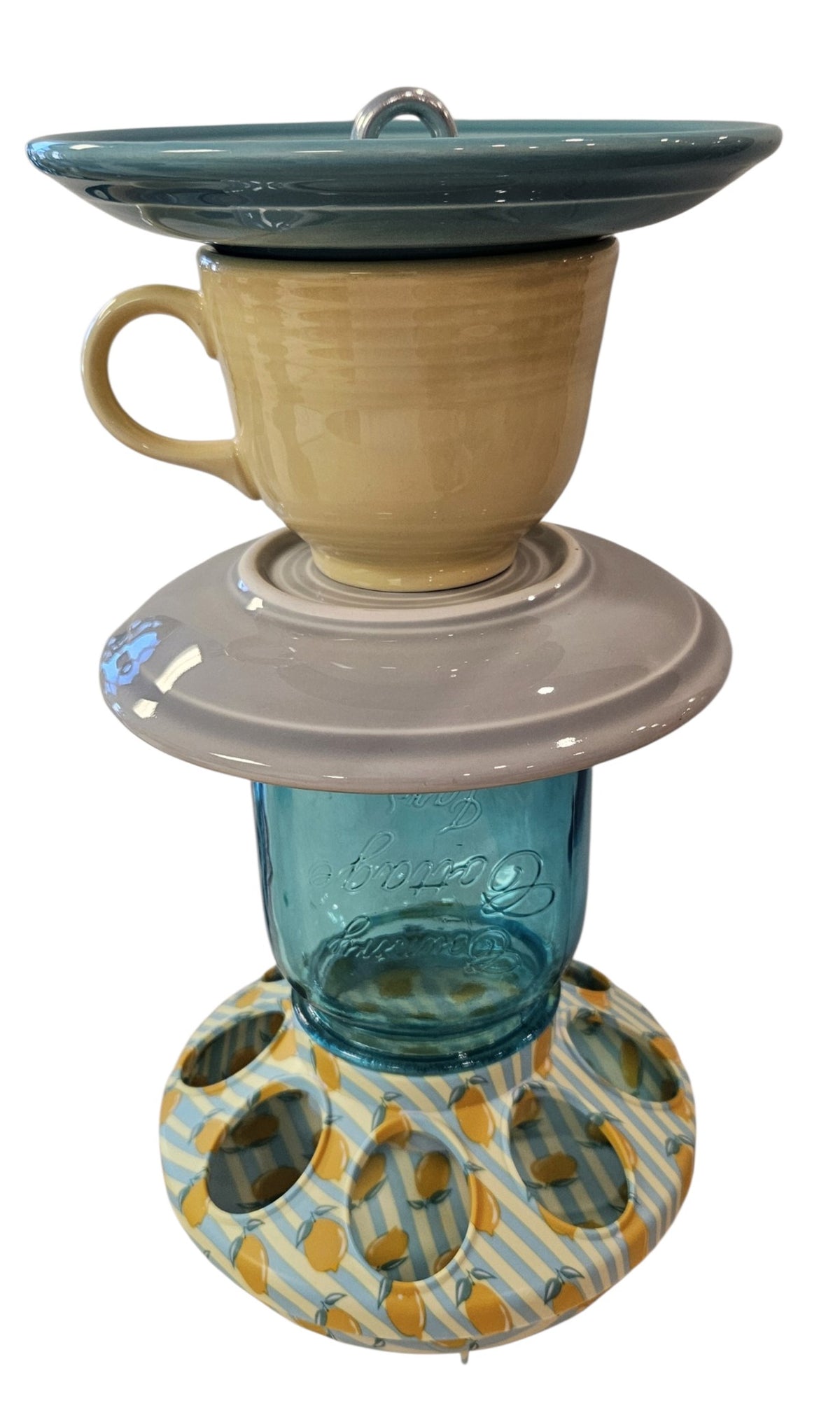 This is a handcrafted Birdfeeder made from a Fiesta Fiestware Cup and two saucers. It includes a glass jar to hold birdseed and either a plastic or metal base for the birds to land and feast. The top saucer is also perfect to hold grape jam or orange slices to feed your local orioles. Please see item description for specific cup and saucer color, jar color and base type. Crafted, Fiesta Second Life
