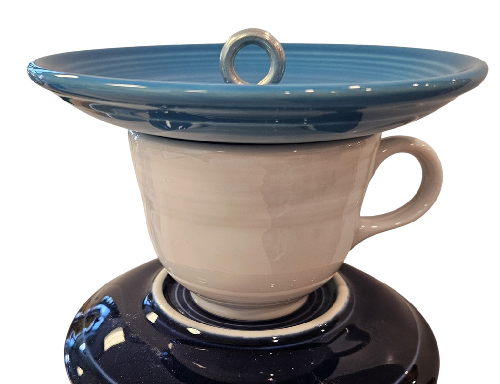 This is a handcrafted Birdfeeder made from a Fiesta Fiestware Cup and two saucers. It includes a glass jar to hold birdseed and either a plastic or metal base for the birds to land and feast. The top saucer is also perfect to hold grape jam or orange slices to feed your local orioles. Please see item description for specific cup and saucer color, jar color and base type. Crafted, Fiesta Second Life
