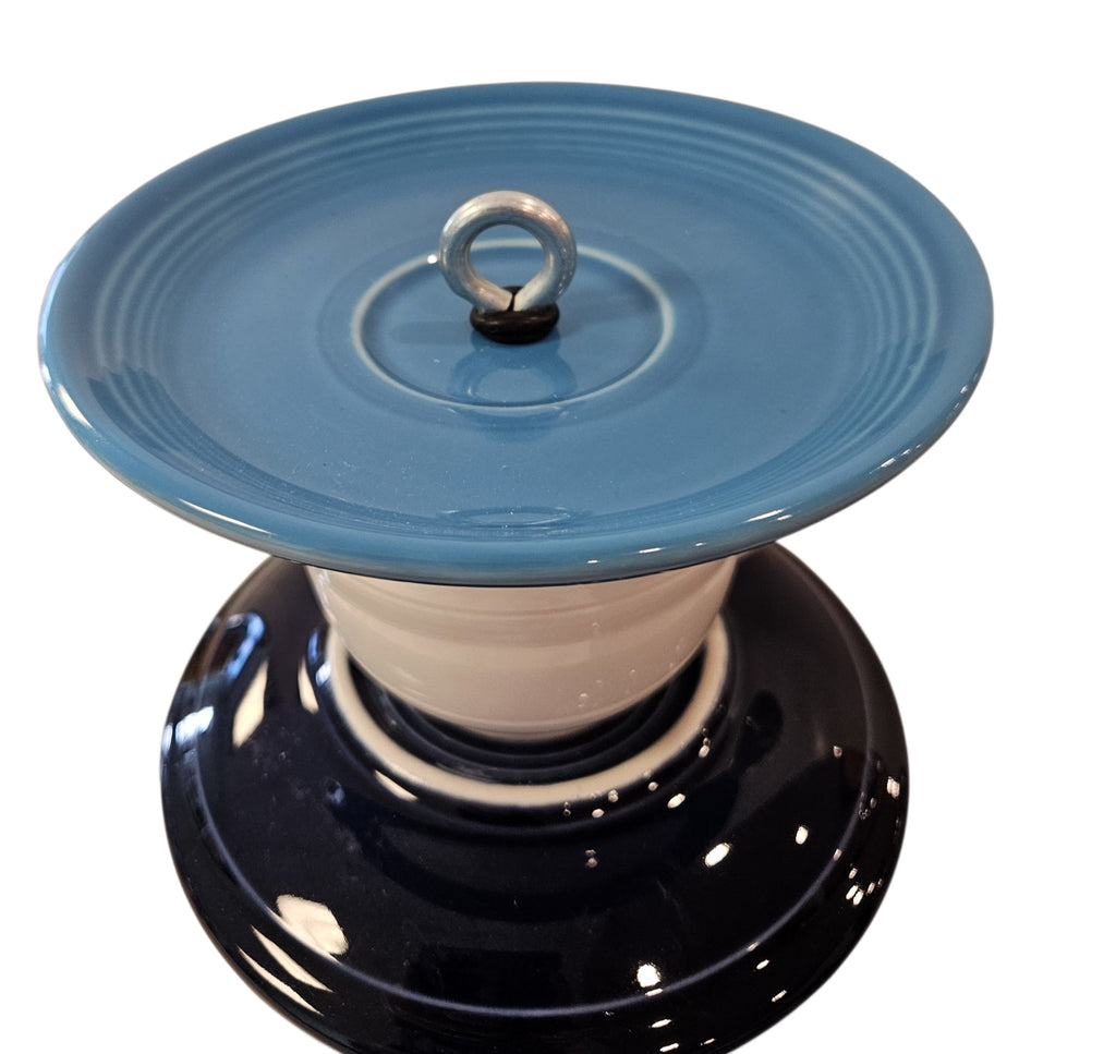 This is a handcrafted Birdfeeder made from a Fiesta Fiestware Cup and two saucers. It includes a glass jar to hold birdseed and either a plastic or metal base for the birds to land and feast. The top saucer is also perfect to hold grape jam or orange slices to feed your local orioles. Please see item description for specific cup and saucer color, jar color and base type. Crafted, Fiesta Second Life
