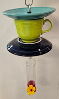 This is a handcrafted Hummingbird Feeder made from a Fiesta Fiestware Cup and two saucers. It includes a plastic nectar holder. While not included but shown in additional pictures, these can be used to hold chimes, a windsock, or other decoration. Please see item description for specific cup and saucer color.  Crafted, Fiesta Second Life
