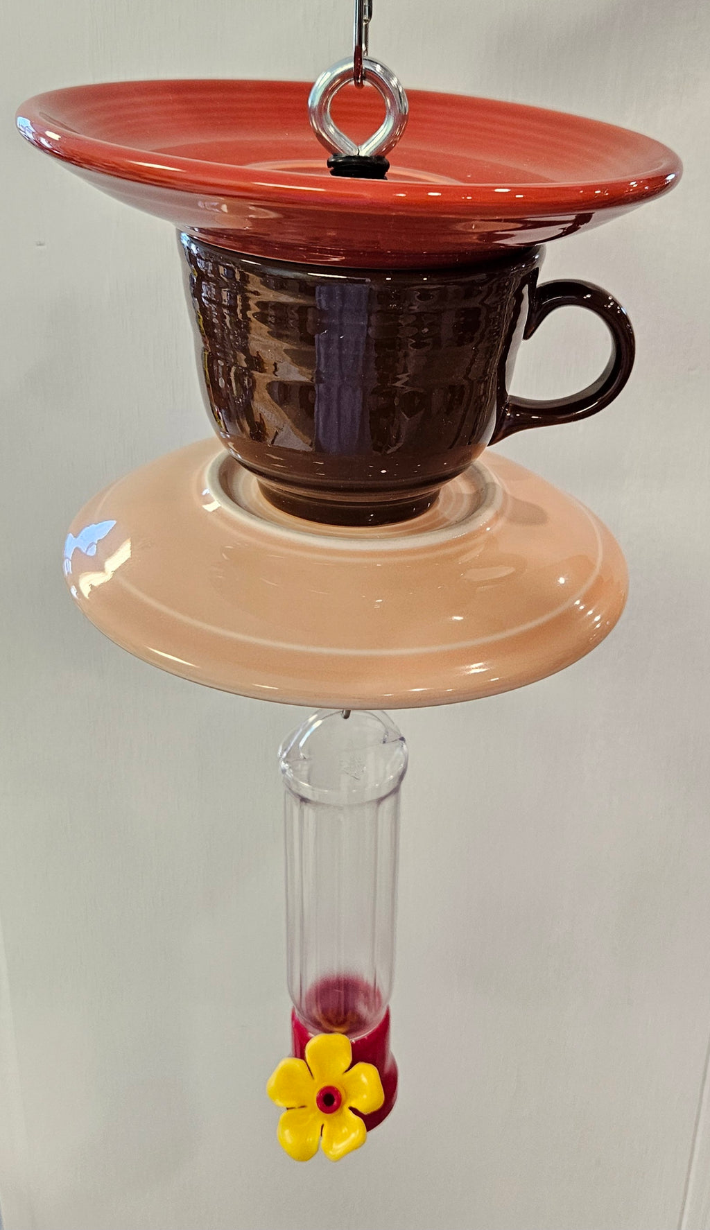 This is a handcrafted Hummingbird Feeder made from a Fiesta Fiestware Cup and two saucers. It includes a plastic nectar holder. While not included but shown in additional pictures, these can be used to hold chimes, a windsock, or other decoration. Please see item description for specific cup and saucer color.  Crafted, Fiesta Second Life
