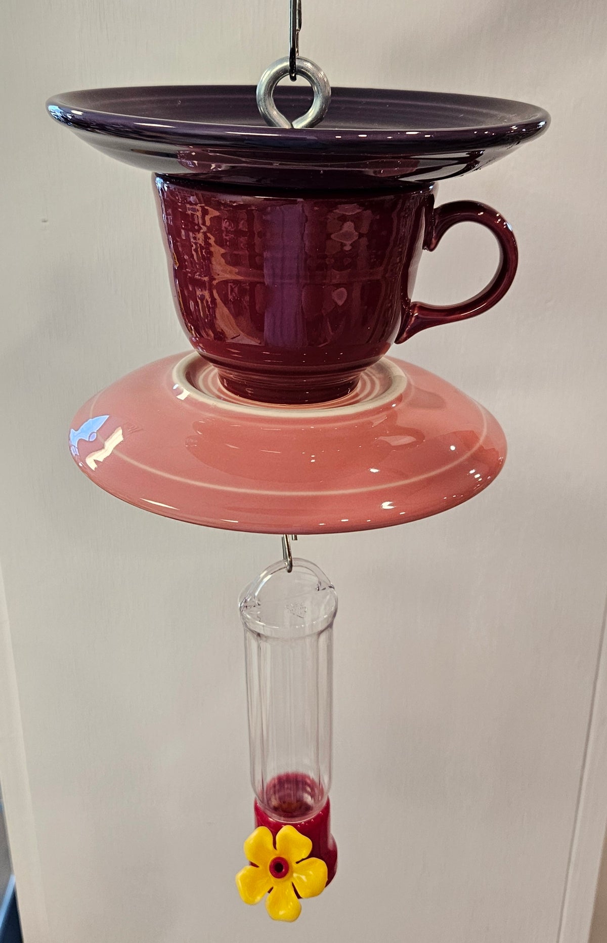 This is a handcrafted Hummingbird Feeder made from a Fiesta Fiestware Cup and two saucers. It includes a plastic nectar holder. While not included but shown in additional pictures, these can be used to hold chimes, a windsock, or other decoration. Please see item description for specific cup and saucer color.  Crafted, Fiesta Second Life
