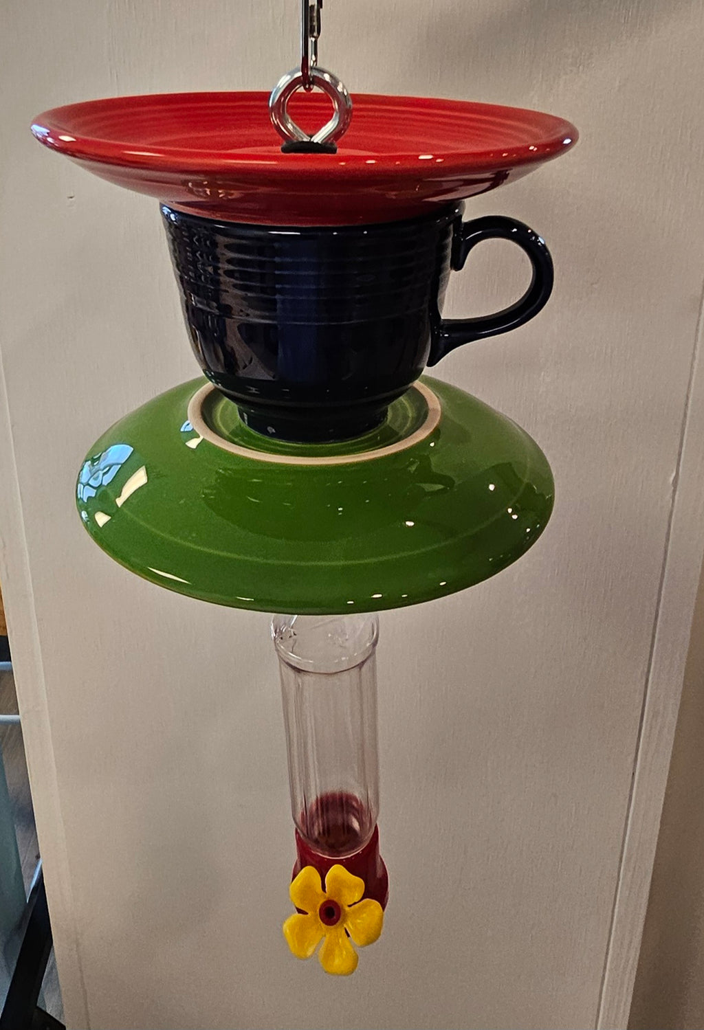 This is a handcrafted Hummingbird Feeder made from a Fiesta Fiestware Cup and two saucers. It includes a plastic nectar holder. While not included but shown in additional pictures, these can be used to hold chimes, a windsock, or other decoration. Please see item description for specific cup and saucer color.  Crafted, Fiesta Second Life
