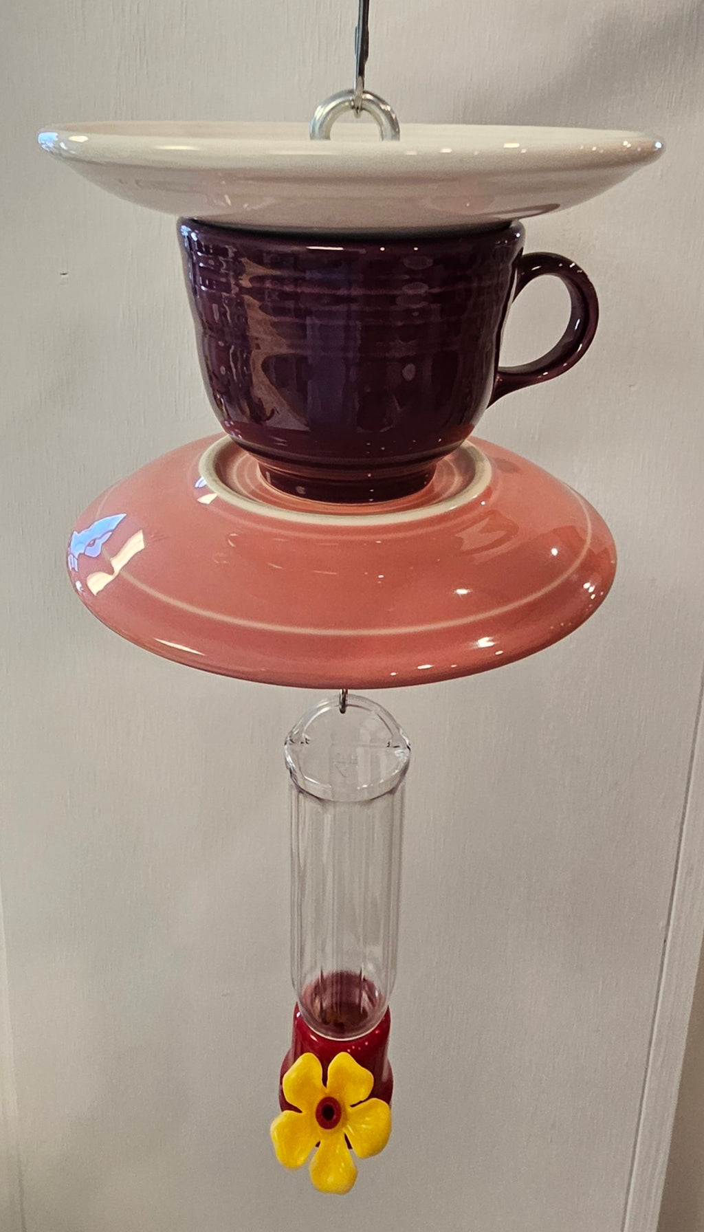 This is a handcrafted Hummingbird Feeder made from a Fiesta Fiestware Cup and two saucers. It includes a plastic nectar holder. While not included but shown in additional pictures, these can be used to hold chimes, a windsock, or other decoration. Please see item description for specific cup and saucer color.  Crafted, Fiesta Second Life
