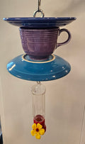 This is a handcrafted Hummingbird Feeder made from a Fiesta Fiestware Cup and two saucers. It includes a plastic nectar holder. While not included but shown in additional pictures, these can be used to hold chimes, a windsock, or other decoration. Please see item description for specific cup and saucer color.  Crafted, Fiesta Second Life
