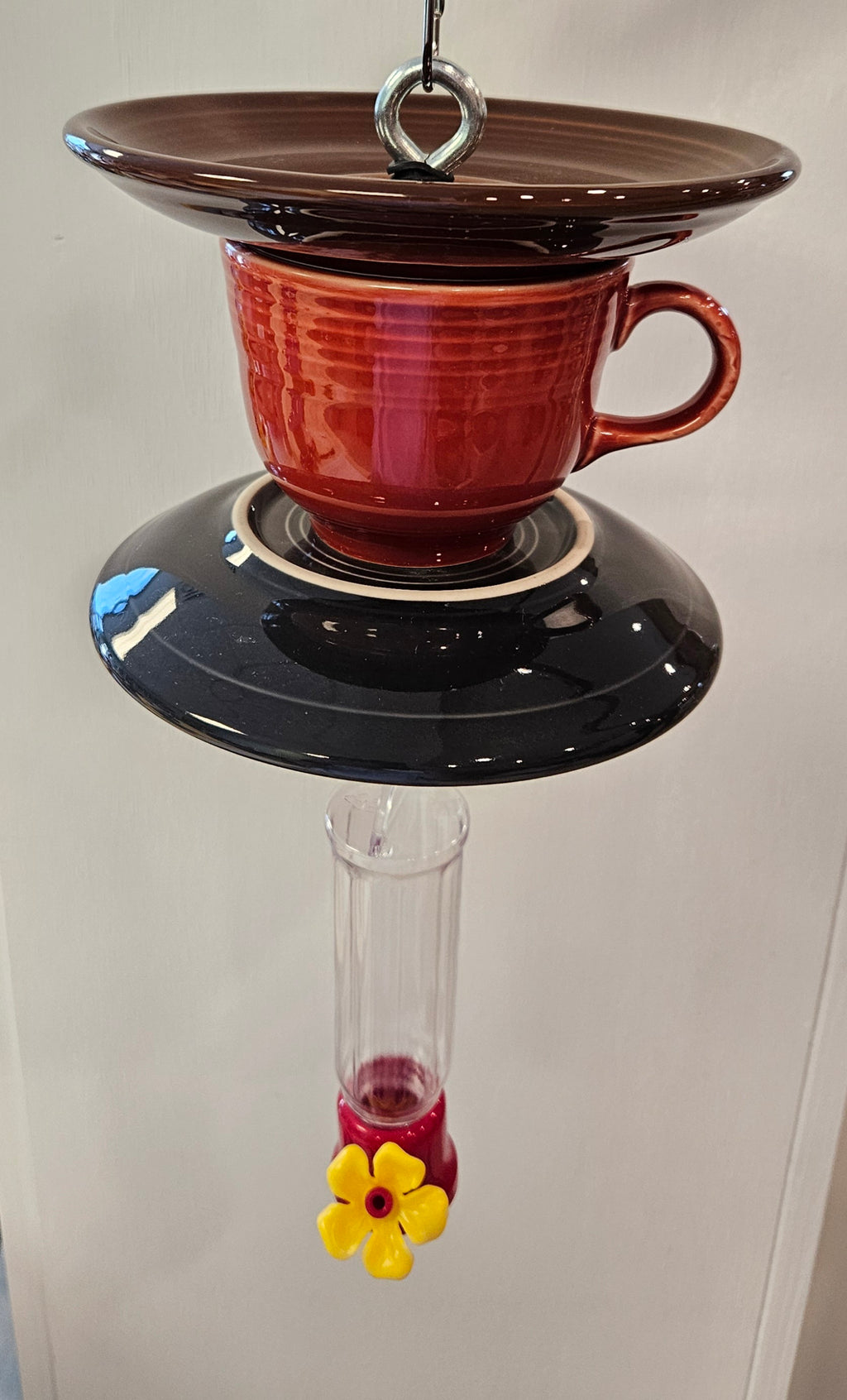 This is a handcrafted Hummingbird Feeder made from a Fiesta Fiestware Cup and two saucers. It includes a plastic nectar holder. While not included but shown in additional pictures, these can be used to hold chimes, a windsock, or other decoration. Please see item description for specific cup and saucer color.  Crafted, Fiesta Second Life

