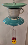 This is a handcrafted Hummingbird Feeder made from a Fiesta Fiestware Cup and two saucers. It includes a plastic nectar holder. While not included but shown in additional pictures, these can be used to hold chimes, a windsock, or other decoration. Please see item description for specific cup and saucer color.  Crafted, Fiesta Second Life
