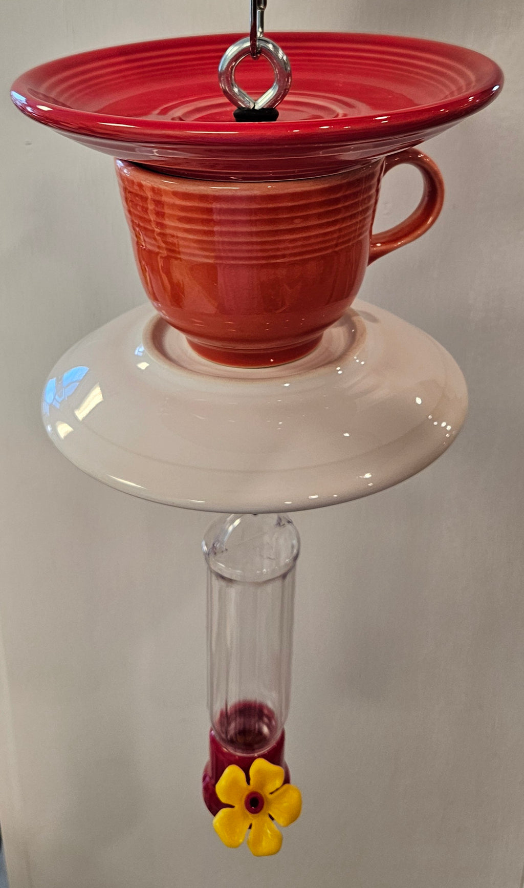 This is a handcrafted Hummingbird Feeder made from a Fiesta Fiestware Cup and two saucers. It includes a plastic nectar holder. While not included but shown in additional pictures, these can be used to hold chimes, a windsock, or other decoration. Please see item description for specific cup and saucer color.  Crafted, Fiesta Second Life
