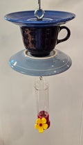 This is a handcrafted Hummingbird Feeder made from a Fiesta Fiestware Cup and two saucers. It includes a plastic nectar holder. While not included but shown in additional pictures, these can be used to hold chimes, a windsock, or other decoration. Please see item description for specific cup and saucer color.  Crafted, Fiesta Second Life

