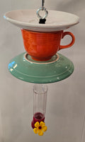 This is a handcrafted Hummingbird Feeder made from a Fiesta Fiestware Cup and two saucers. It includes a plastic nectar holder. While not included but shown in additional pictures, these can be used to hold chimes, a windsock, or other decoration. Please see item description for specific cup and saucer color.  Crafted, Fiesta Second Life
