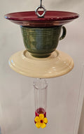 This is a handcrafted Hummingbird Feeder made from a Fiesta Fiestware Cup and two saucers. It includes a plastic nectar holder. While not included but shown in additional pictures, these can be used to hold chimes, a windsock, or other decoration. Please see item description for specific cup and saucer color.  Crafted, Fiesta Second Life
