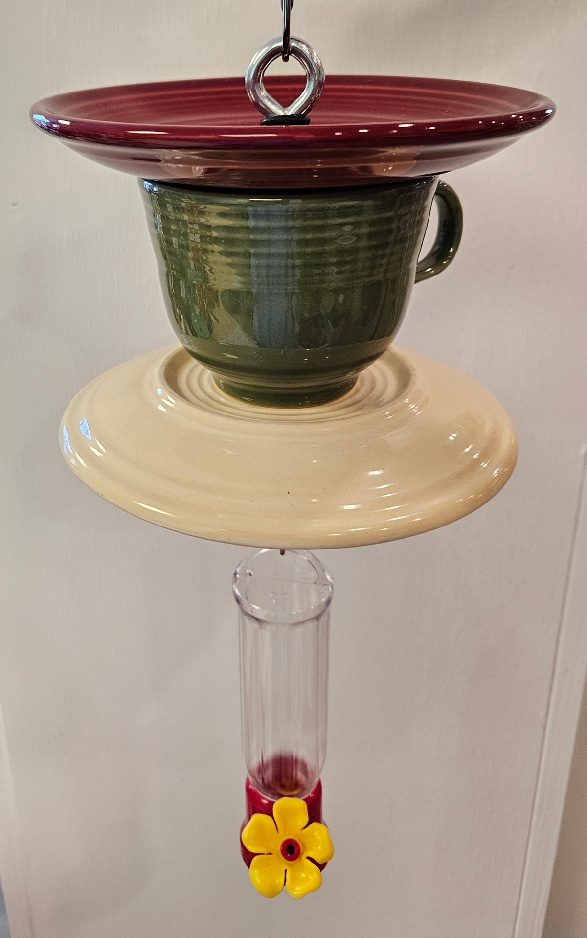 This is a handcrafted Hummingbird Feeder made from a Fiesta Fiestware Cup and two saucers. It includes a plastic nectar holder. While not included but shown in additional pictures, these can be used to hold chimes, a windsock, or other decoration. Please see item description for specific cup and saucer color.  Crafted, Fiesta Second Life
