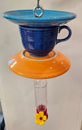 This is a handcrafted Hummingbird Feeder made from a Fiesta Fiestware Cup and two saucers. It includes a plastic nectar holder. While not included but shown in additional pictures, these can be used to hold chimes, a windsock, or other decoration. Please see item description for specific cup and saucer color.  Crafted, Fiesta Second Life
