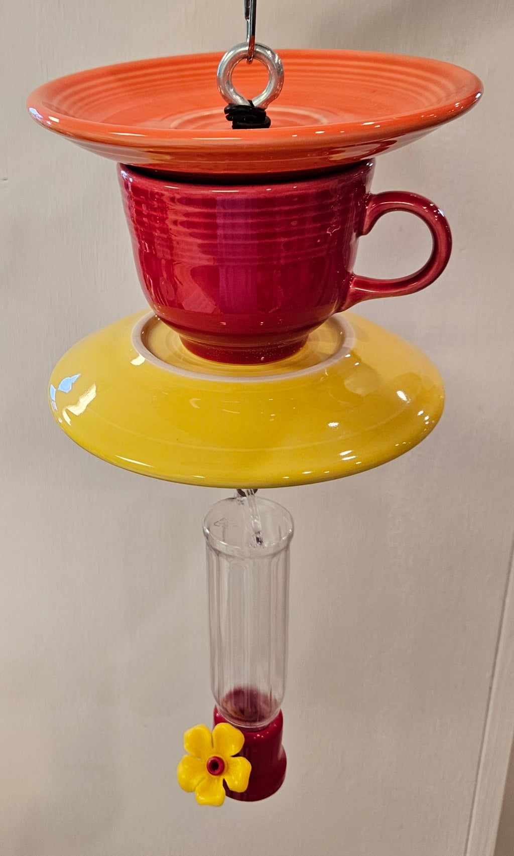 This is a handcrafted Hummingbird Feeder made from a Fiesta Fiestware Cup and two saucers. It includes a plastic nectar holder. While not included but shown in additional pictures, these can be used to hold chimes, a windsock, or other decoration. Please see item description for specific cup and saucer color.  Crafted, Fiesta Second Life
