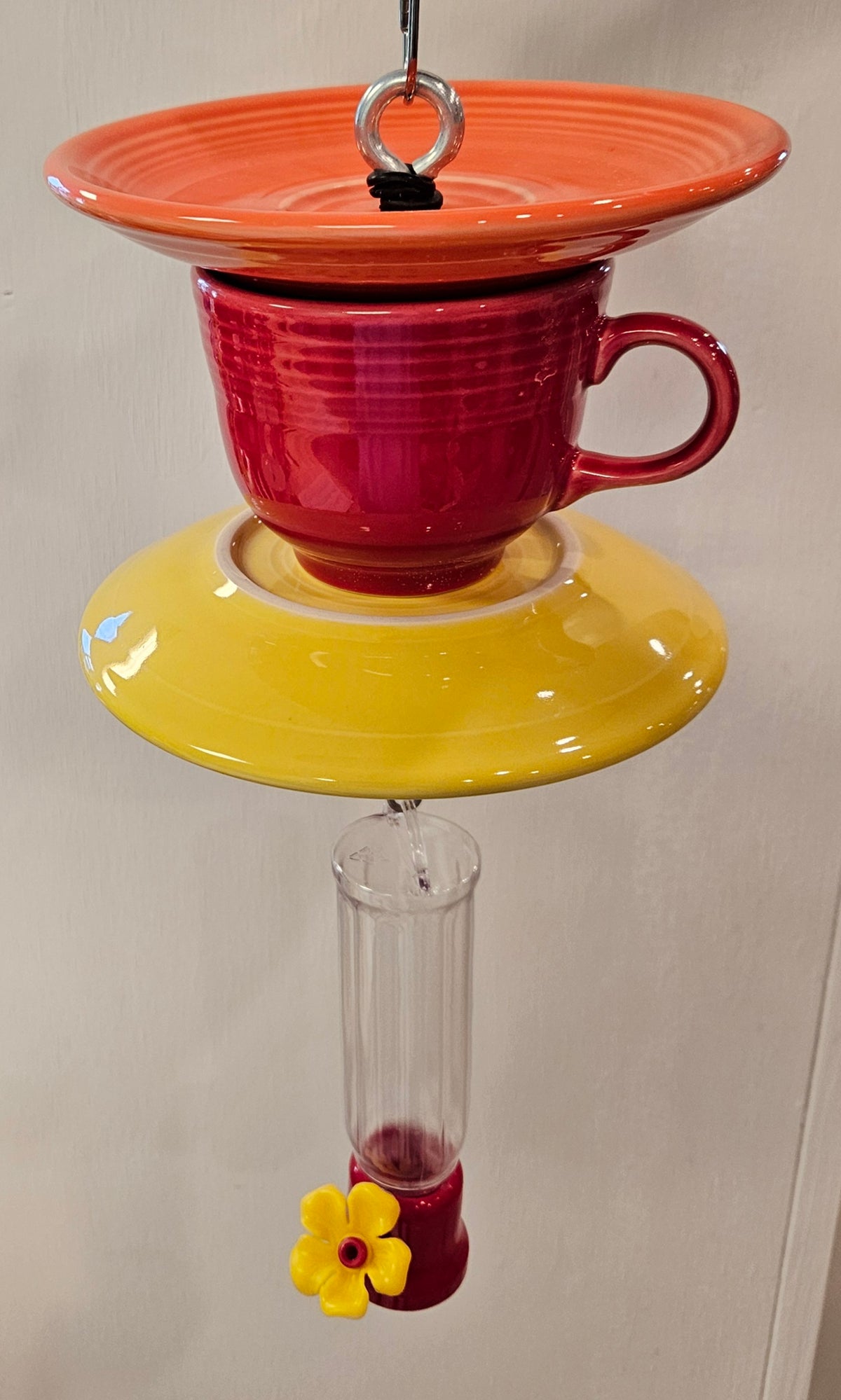 This is a handcrafted Hummingbird Feeder made from a Fiesta Fiestware Cup and two saucers. It includes a plastic nectar holder. While not included but shown in additional pictures, these can be used to hold chimes, a windsock, or other decoration. Please see item description for specific cup and saucer color.  Crafted, Fiesta Second Life
