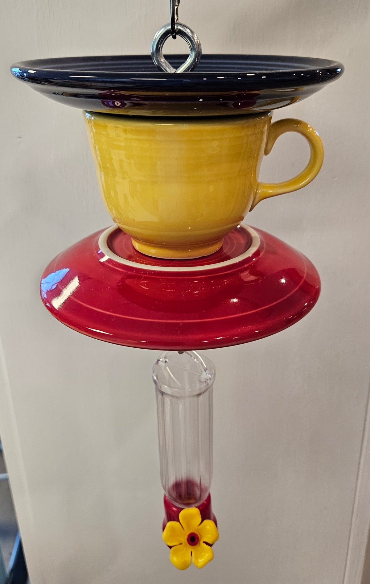 This is a handcrafted Hummingbird Feeder made from a Fiesta Fiestware Cup and two saucers. It includes a plastic nectar holder. While not included but shown in additional pictures, these can be used to hold chimes, a windsock, or other decoration. Please see item description for specific cup and saucer color.  Crafted, Fiesta Second Life

