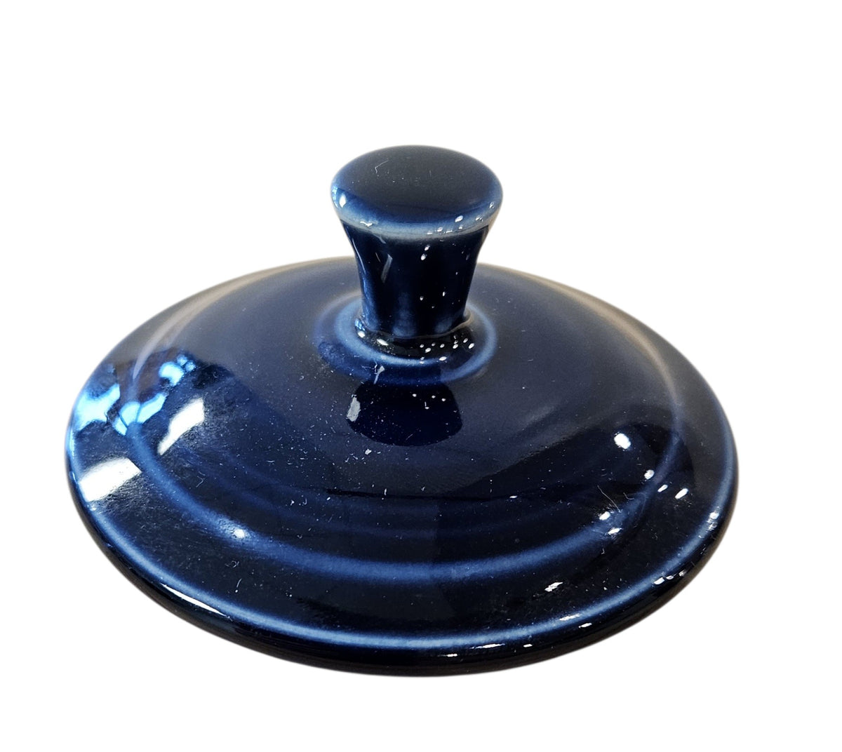 This is a Fiesta Fiestaware Individual Sugar Bowl With Lid in cobalt. lead-free, Post 1986, Retired Color Retired Shape