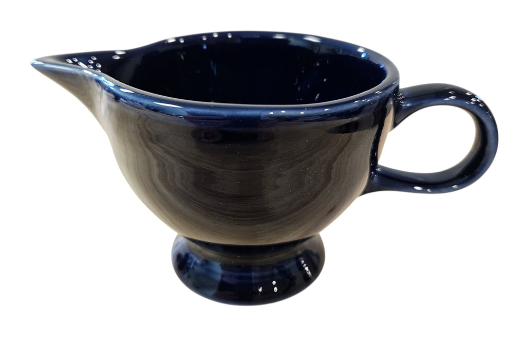 This is a Fiesta Fiestaware individual cream pitcher creamer in Plum. lead-free, Post 1986, Retired Color Retired Shape
