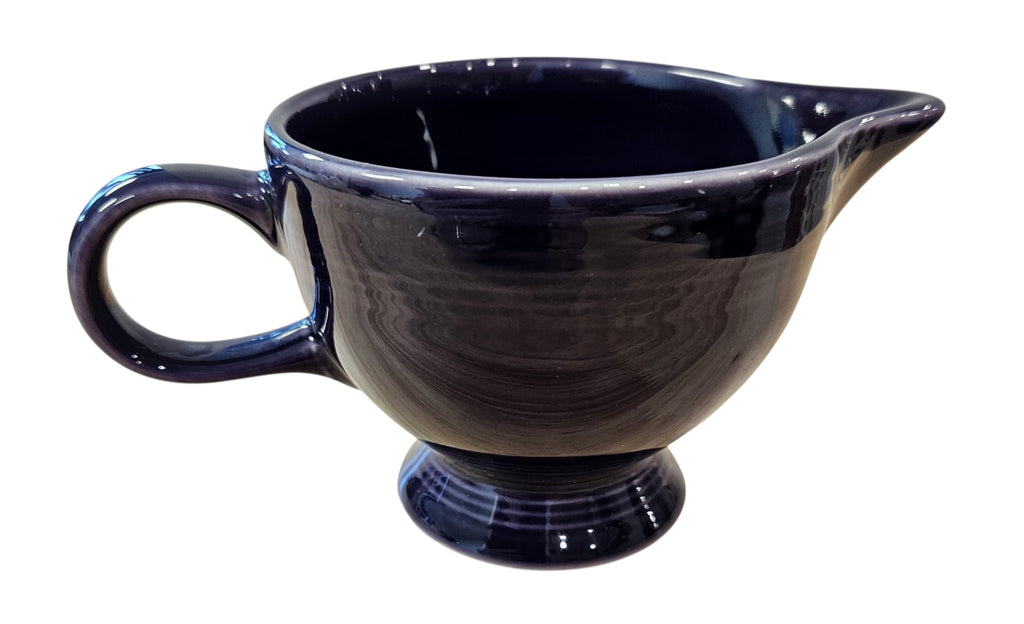 This is a Fiesta Fiestaware individual cream pitcher creamer in Plum. lead-free, Post 1986, Retired Color Retired Shape
