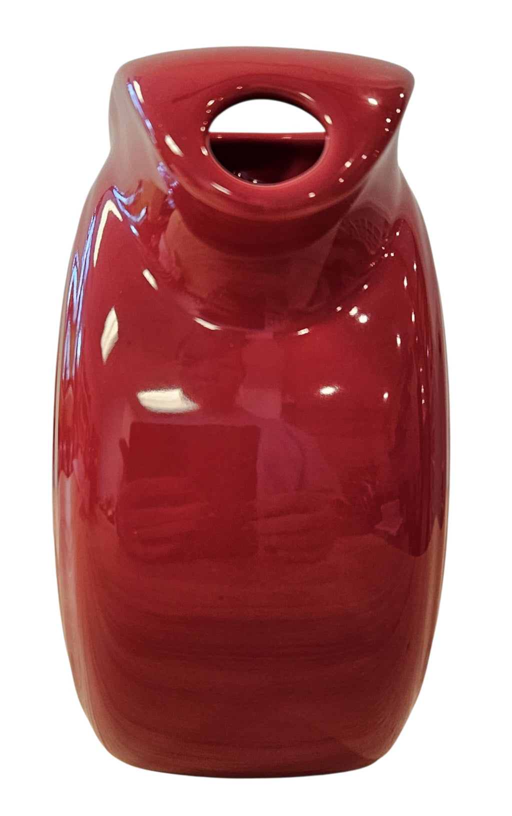 This is a Fiesta Fiestaware Small Disc Juice Pitcher in scarlet. lead-free, Post 1986, Retired Shape 28 ounce capacity
