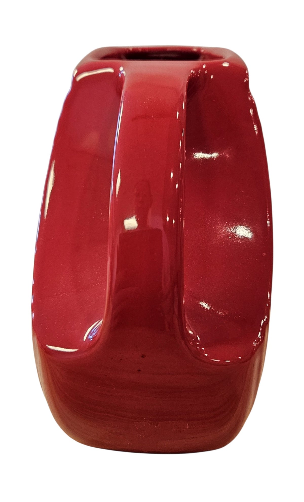 This is a Fiesta Fiestaware Small Disc Juice Pitcher in scarlet. lead-free, Post 1986, Retired Shape 28 ounce capacity
