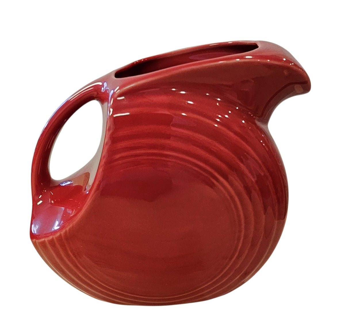 This is a Fiesta Fiestaware Large Disc Water Pitcher in Scarlet. lead-free, Post 1986, Retired Shape 67 ounce capacity
