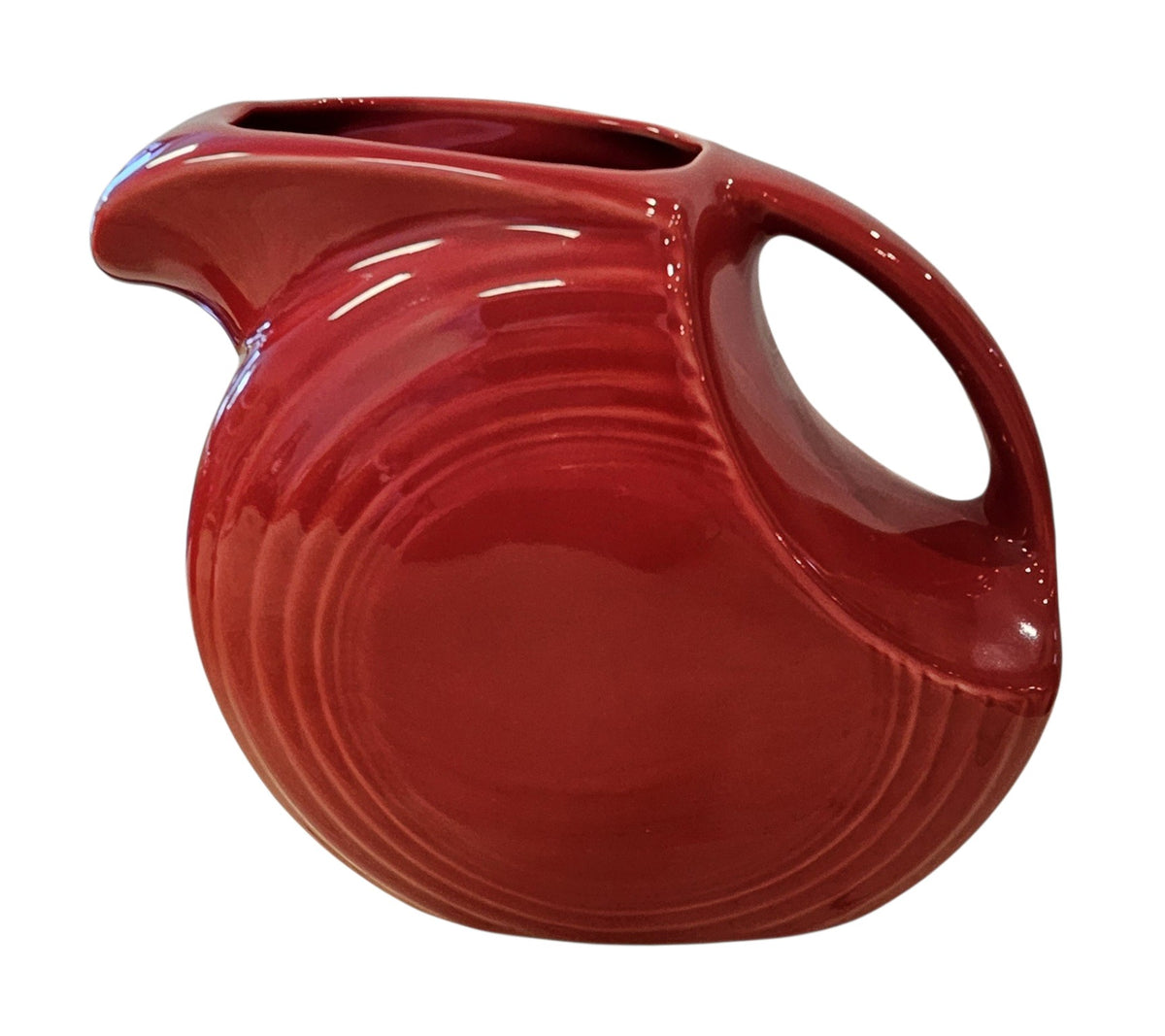 This is a Fiesta Fiestaware Large Disc Water Pitcher in Scarlet. lead-free, Post 1986, Retired Shape 67 ounce capacity
