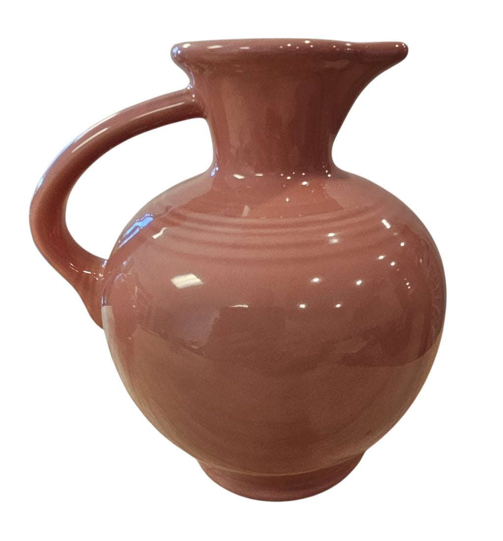 This is a Fiesta Fiestware 60 Ounce Carafe in Rose. Lead-free Post 1986 Retired color retired shape

