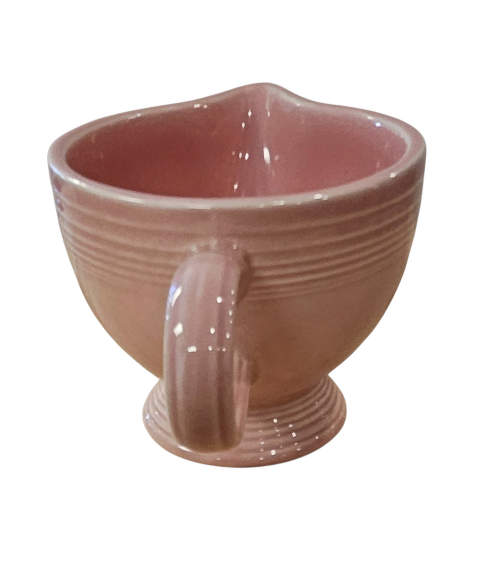 This is a Fiesta Fiestaware individual cream pitcher creamer in Rose. lead-free, Post 1986, Retired Color Retired Shape
