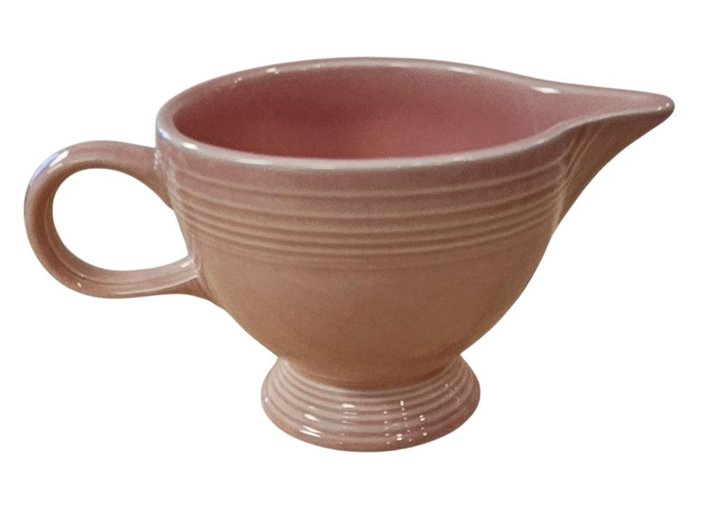 This is a Fiesta Fiestaware individual cream pitcher creamer in Rose. lead-free, Post 1986, Retired Color Retired Shape
