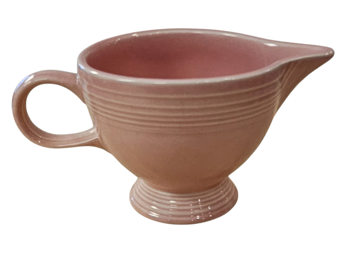 This is a Fiesta Fiestaware individual cream pitcher creamer in Rose. lead-free, Post 1986, Retired Color Retired Shape
