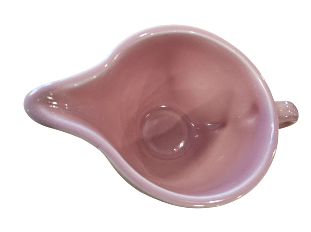 This is a Fiesta Fiestaware individual cream pitcher creamer in Rose. lead-free, Post 1986, Retired Color Retired Shape

