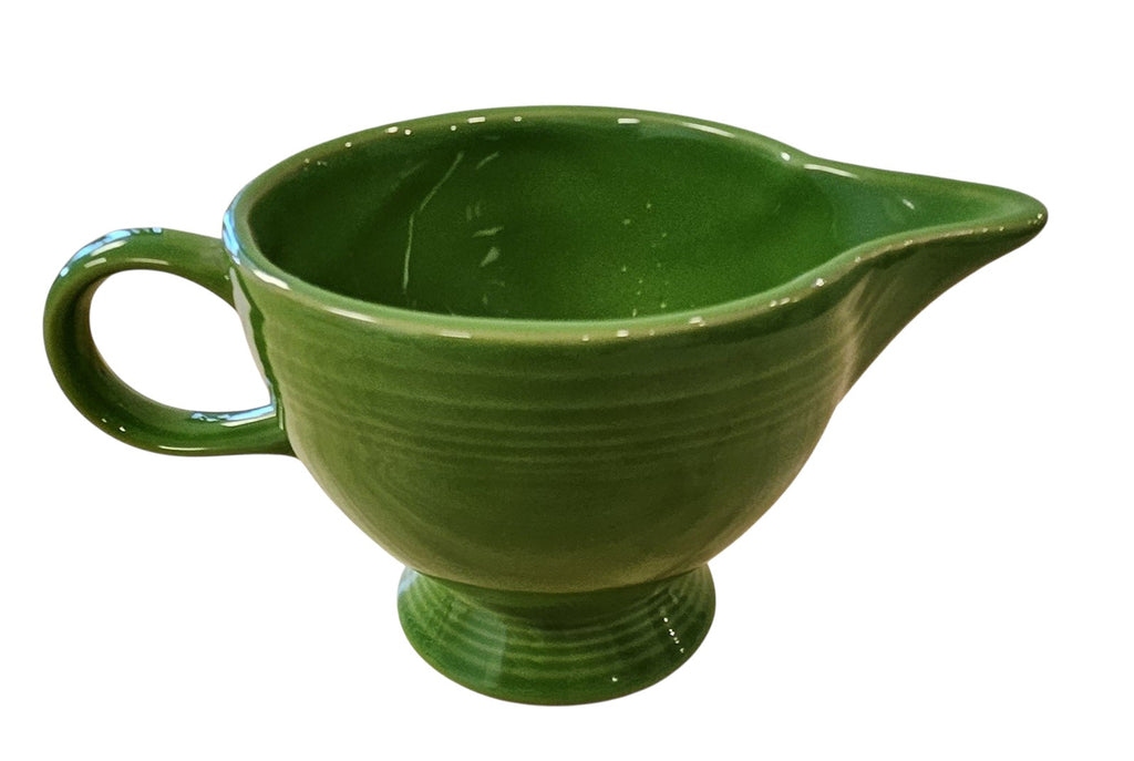 This is a Fiesta Fiestaware individual cream pitcher creamer in Shamrock. lead-free, Post 1986, Retired Color Retired Shape
