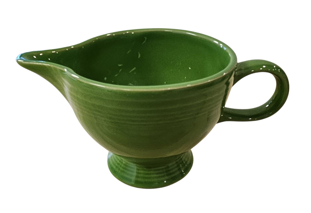 This is a Fiesta Fiestaware individual cream pitcher creamer in Shamrock. lead-free, Post 1986, Retired Color Retired Shape
